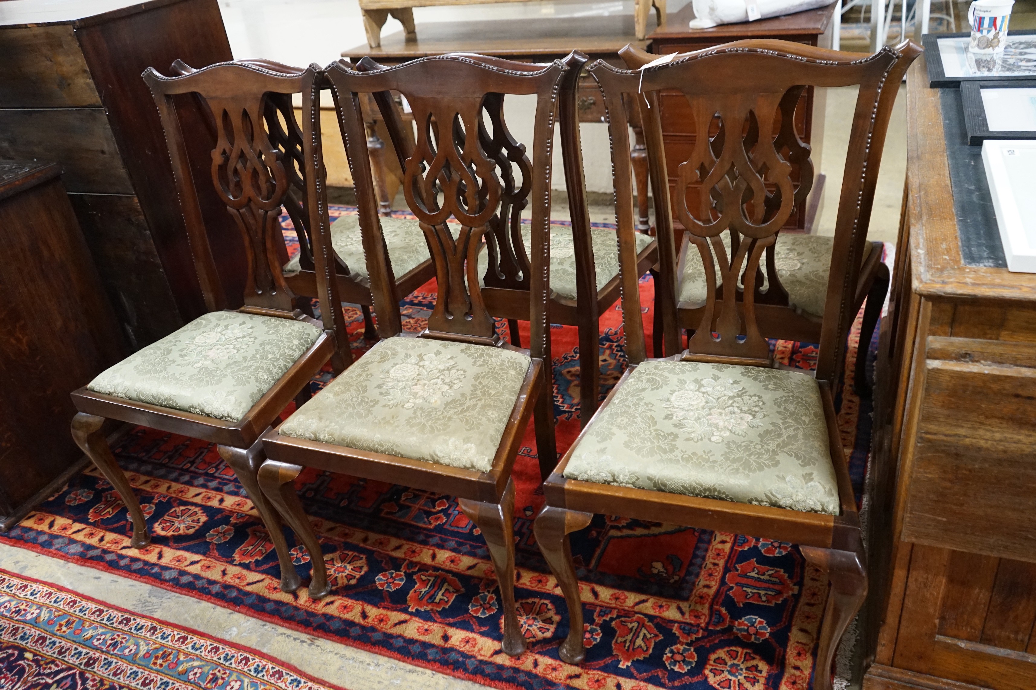 A set of six Chippendale style mahogany dining chairs